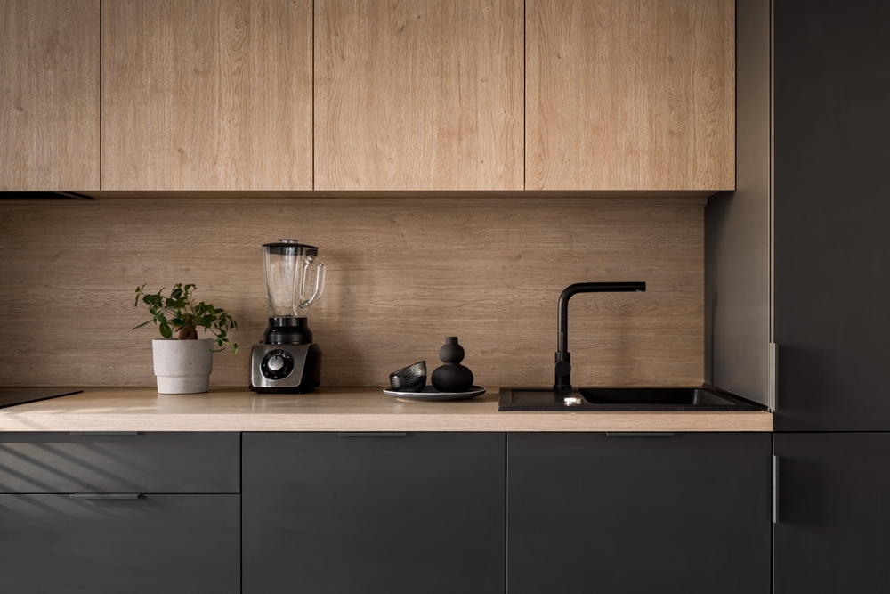 Modern kitchen with oak upper cabinets and matte black lower cabinets