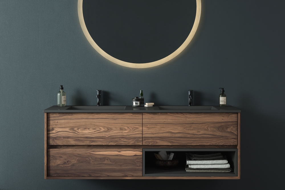 Custom floating walnut bathroom vanity with double sink and round LED mirror